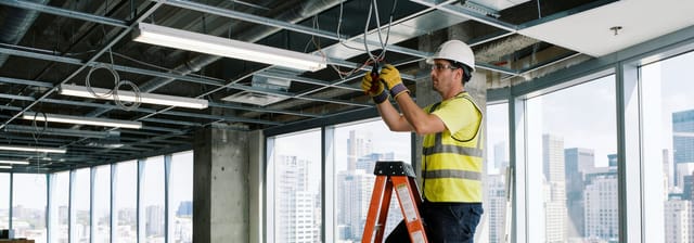 Commercial fit-out: conduit and switchgear installed in a business building interior.